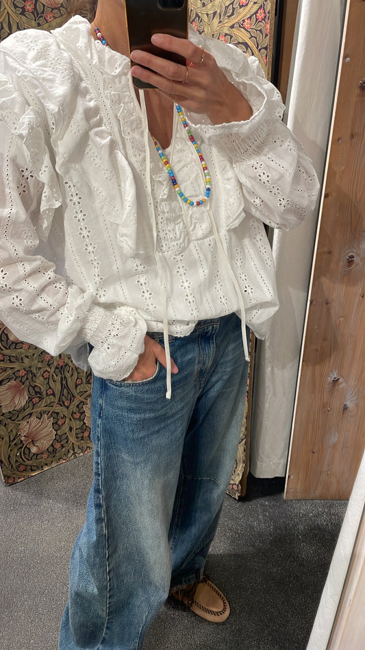 Blusa sangallo con volant e maniche lunghe