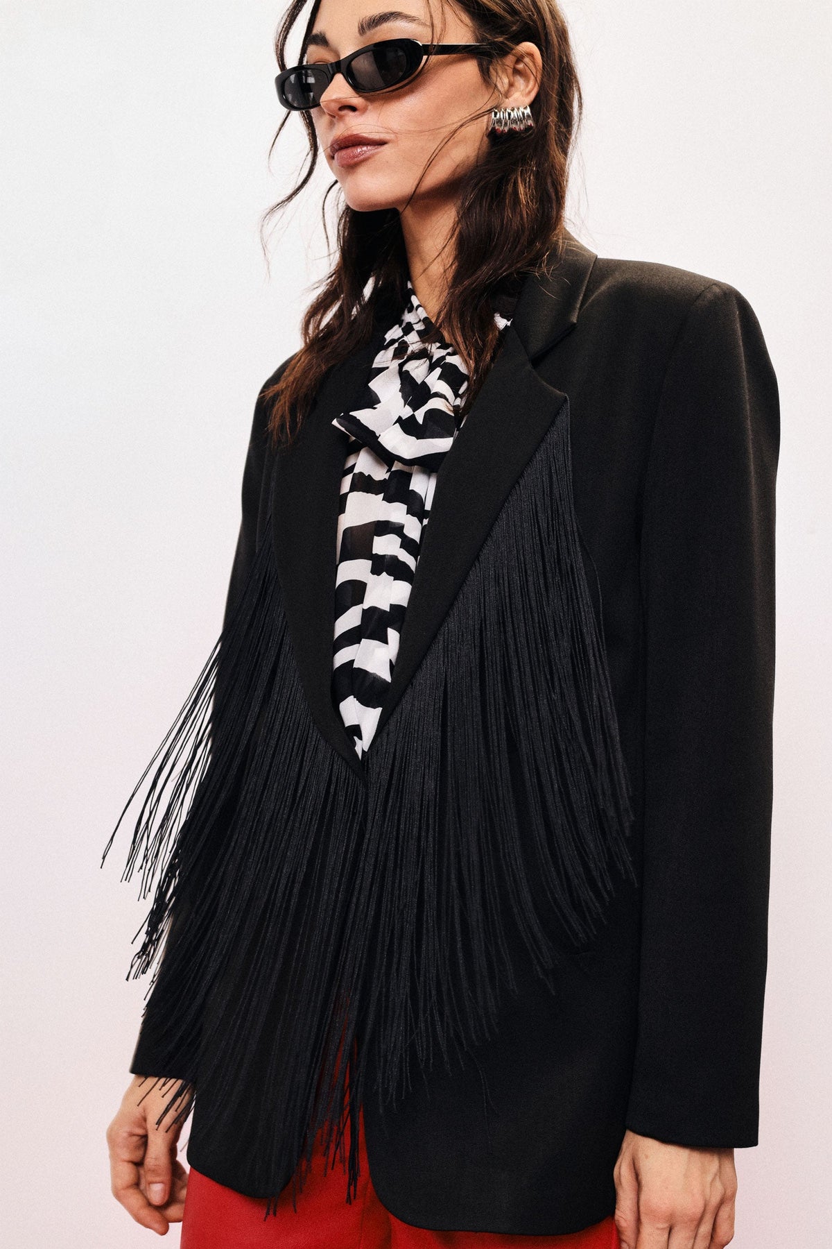 Blazer con frange decorative e revers classico