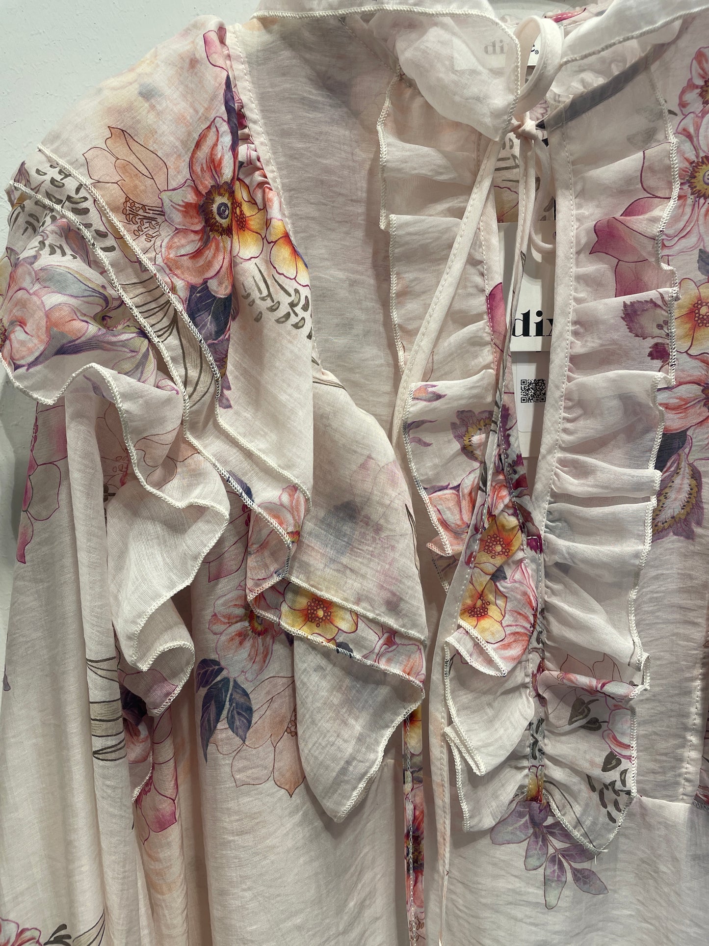 Blusa a fiori con volant manica lunga